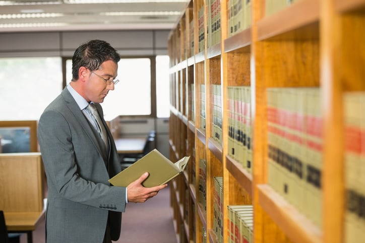 Lawyer reading book in the law library at the university.jpeg